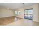 Living room with tile floors, sliding doors, and a view of the backyard at 18000 N Estrella Vista Dr, Surprise, AZ 85374
