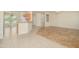 Open living room with tile floors and views into kitchen and dining areas at 18000 N Estrella Vista Dr, Surprise, AZ 85374