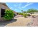 Landscaped backyard with desert plants, gravel, and a water feature at 18000 N Estrella Vista Dr, Surprise, AZ 85374