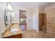 Bathroom with double sinks, granite countertop, and walk-in shower at 18000 N Estrella Vista Dr, Surprise, AZ 85374