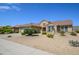 One-story house with a two-car garage and nicely landscaped yard at 18000 N Estrella Vista Dr, Surprise, AZ 85374