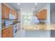 Kitchen with granite countertops, wood cabinets and stainless steel appliances at 18000 N Estrella Vista Dr, Surprise, AZ 85374