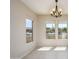 Bright dining room with tile floors and large windows offering natural light at 18000 N Estrella Vista Dr, Surprise, AZ 85374