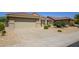Single-story home with attached garage and desert landscaping at 18000 N Estrella Vista Dr, Surprise, AZ 85374