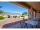 Relaxing backyard patio with seating area and desert landscaping at 18000 N Estrella Vista Dr, Surprise, AZ 85374