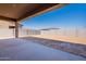 Covered patio overlooking a large, sunny backyard at 18944 W Ocotillo Rd, Waddell, AZ 85355