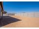 Backyard view of home with block wall and mountain views at 18944 W Ocotillo Rd, Waddell, AZ 85355