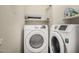 Bright laundry room with Samsung washer and dryer at 6744 S Haunted Canyon Rd, Gold Canyon, AZ 85118