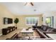 Spacious living room with leather furniture and a large flat-screen TV at 6744 S Haunted Canyon Rd, Gold Canyon, AZ 85118