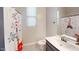 Simple bathroom with shower/tub combo and updated vanity at 10611 E Tumbleweed Ave, Mesa, AZ 85212