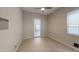 Bright bedroom with tile flooring and access to outdoor space at 10611 E Tumbleweed Ave, Mesa, AZ 85212