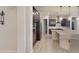 Modern kitchen with dark cabinetry, granite island and tile flooring at 10611 E Tumbleweed Ave, Mesa, AZ 85212