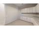Kitchen with white cabinets, granite counters, and ample storage at 10611 E Tumbleweed Ave, Mesa, AZ 85212