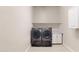 Laundry room with washer and dryer and additional storage at 10611 E Tumbleweed Ave, Mesa, AZ 85212