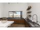 Modern community kitchen with stainless steel appliances and breakfast bar at 10611 E Tumbleweed Ave, Mesa, AZ 85212