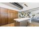 Modern community kitchen features sleek cabinetry and a large island at 10611 E Tumbleweed Ave, Mesa, AZ 85212