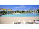 Community pool with water features and lounge chairs at 10611 E Tumbleweed Ave, Mesa, AZ 85212