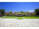 Artificial turf backyard with patio and water feature at 10611 E Tumbleweed Ave, Mesa, AZ 85212