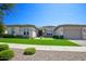 Single-story home with a two-car garage and manicured lawn at 10611 E Tumbleweed Ave, Mesa, AZ 85212
