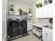 Bright laundry room with washer, dryer, and ample storage at 10611 E Tumbleweed Ave, Mesa, AZ 85212