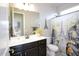 Bathroom with double sinks and a shower/tub combo at 10611 E Tumbleweed Ave, Mesa, AZ 85212