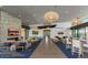 Large community lounge with seating areas and natural light at 10611 E Tumbleweed Ave, Mesa, AZ 85212