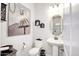 Powder room with pedestal sink and decorative art at 10611 E Tumbleweed Ave, Mesa, AZ 85212