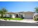 Single-story home with artificial turf at 10611 E Tumbleweed Ave, Mesa, AZ 85212