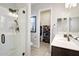 Bathroom with a walk-in shower, vanity, and walk-in closet at 10611 E Tumbleweed Ave, Mesa, AZ 85212