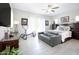 Large main bedroom with king-size bed and access to backyard at 10611 E Tumbleweed Ave, Mesa, AZ 85212