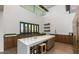 Island kitchen with white countertops and wood cabinets in a community space at 10611 E Tumbleweed Ave, Mesa, AZ 85212