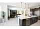 Kitchen island with seating overlooking the living room at 10611 E Tumbleweed Ave, Mesa, AZ 85212