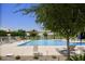 Resort-style pool with shade structures and lounge chairs at 10611 E Tumbleweed Ave, Mesa, AZ 85212