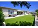 Spacious backyard with artificial turf and hot tub at 10611 E Tumbleweed Ave, Mesa, AZ 85212