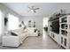 Spacious living room featuring a large sectional sofa and built-in entertainment center at 10611 E Tumbleweed Ave, Mesa, AZ 85212