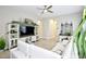 Spacious living room with white sectional sofa and entertainment center at 10611 E Tumbleweed Ave, Mesa, AZ 85212
