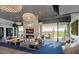 Community room with stylish seating, fireplace, and outdoor views at 10611 E Tumbleweed Ave, Mesa, AZ 85212
