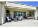 Relaxing covered patio with fire pit and seating at 10611 E Tumbleweed Ave, Mesa, AZ 85212