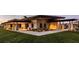 Stunning exterior view of a contemporary home at dusk at 10611 E Tumbleweed Ave, Mesa, AZ 85212