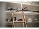Well-organized pantry with pull-down ladder and ample shelving at 10611 E Tumbleweed Ave, Mesa, AZ 85212