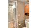 Bathroom with stackable washer and dryer and toilet at 1111 E University Dr # 135, Tempe, AZ 85288