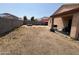 Large backyard with a fire pit and covered patio at 22005 W Cocopah St, Buckeye, AZ 85326