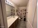 Clean bathroom with single vanity and shower at 22005 W Cocopah St, Buckeye, AZ 85326