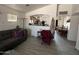 Open concept living room with a view of the kitchen and dining area at 22005 W Cocopah St, Buckeye, AZ 85326