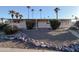 Front view of a manufactured home with palm trees and rock landscaping at 120 N Val Vista Dr # 264, Mesa, AZ 85213