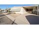 Single-wide manufactured home with carport and desert landscaping at 120 N Val Vista Dr # 264, Mesa, AZ 85213