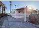 Mobile home exterior with covered patio and desert landscaping at 120 N Val Vista Dr # 264, Mesa, AZ 85213