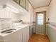 Laundry room with washer, dryer and exterior access at 120 N Val Vista Dr # 264, Mesa, AZ 85213