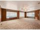 Spacious living room with carpeted floors and large windows at 120 N Val Vista Dr # 264, Mesa, AZ 85213