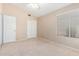 Bright bedroom with double door closet and window coverings at 8814 E Sunnyside Dr, Scottsdale, AZ 85260